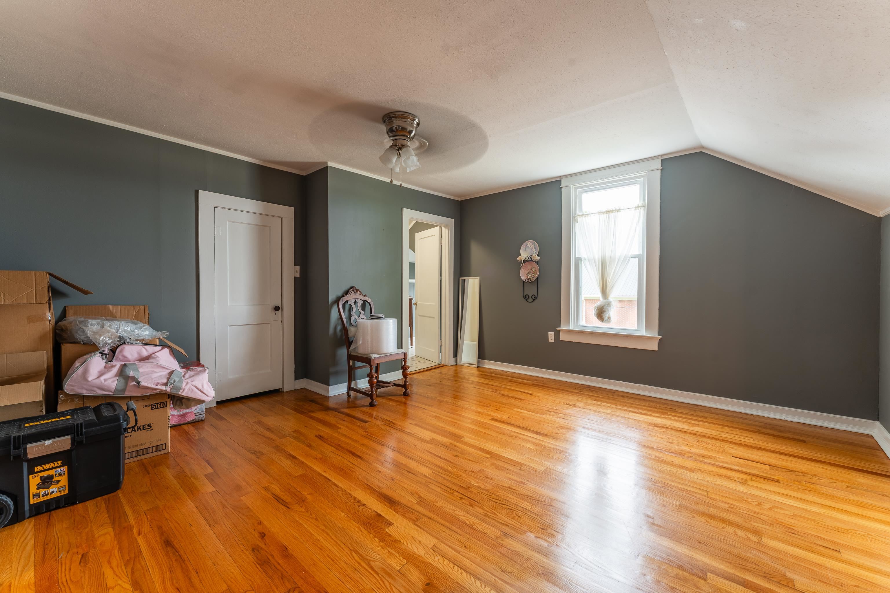 171 White Street Savannah, TN 38372 - Photo 23 of 36 a view of an empty room with window and wooden floor