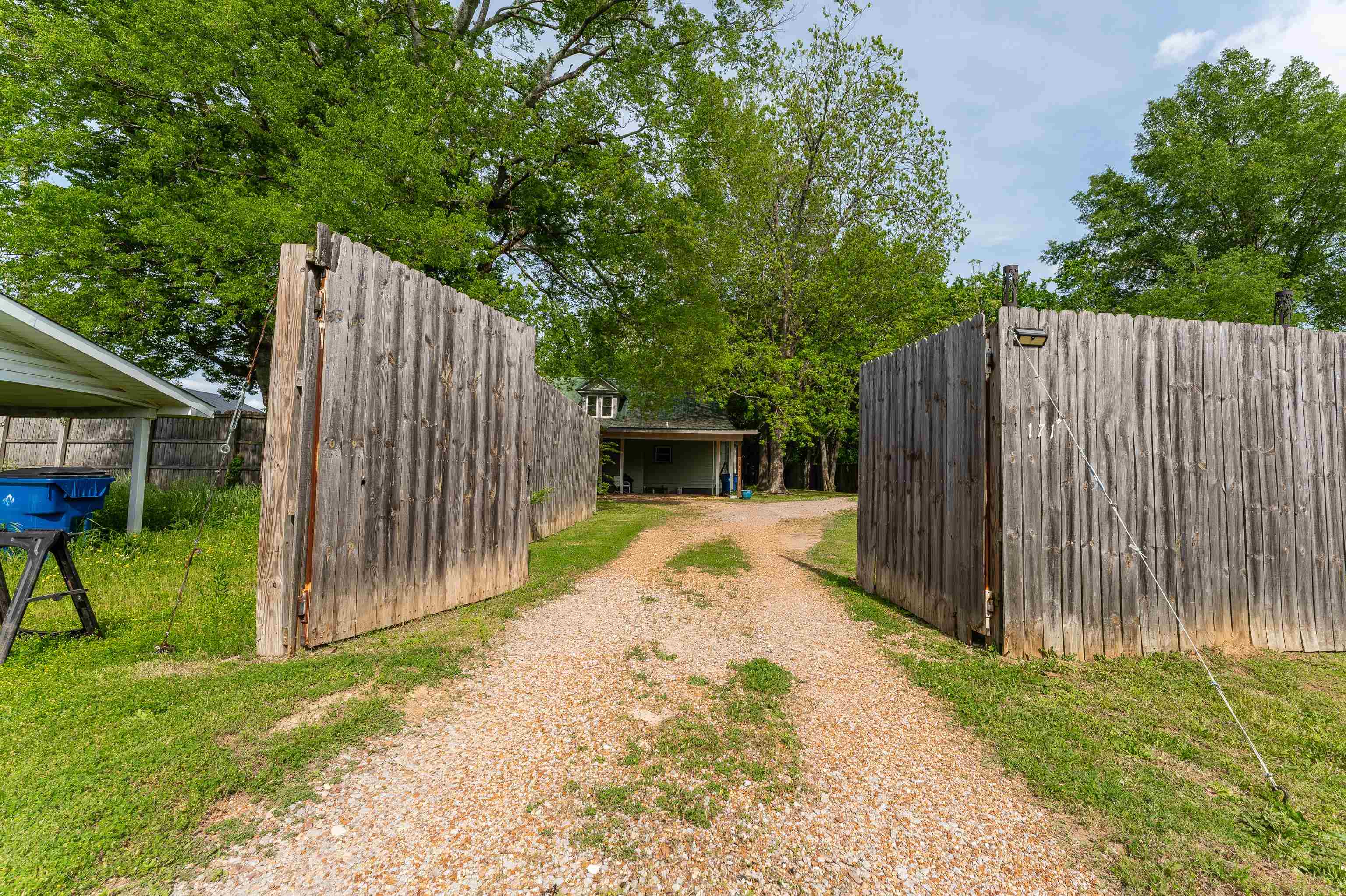 171 White Street Savannah, TN 38372 - Photo 31 of 36 a view of backyard with wooden fence and a large tree