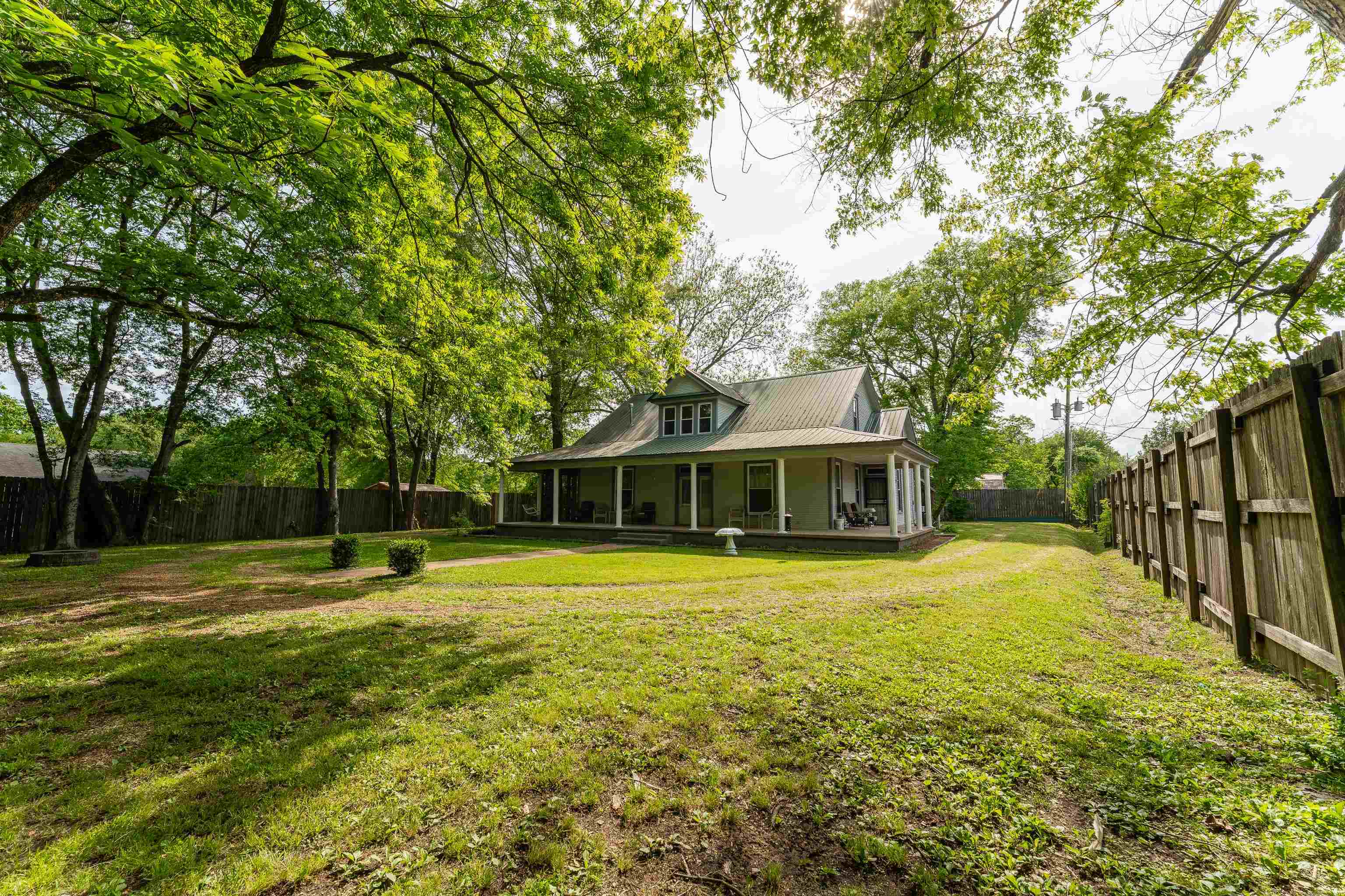 171 White Street Savannah, TN 38372 - Photo 34 of 36 a view of a house with a yard and large trees