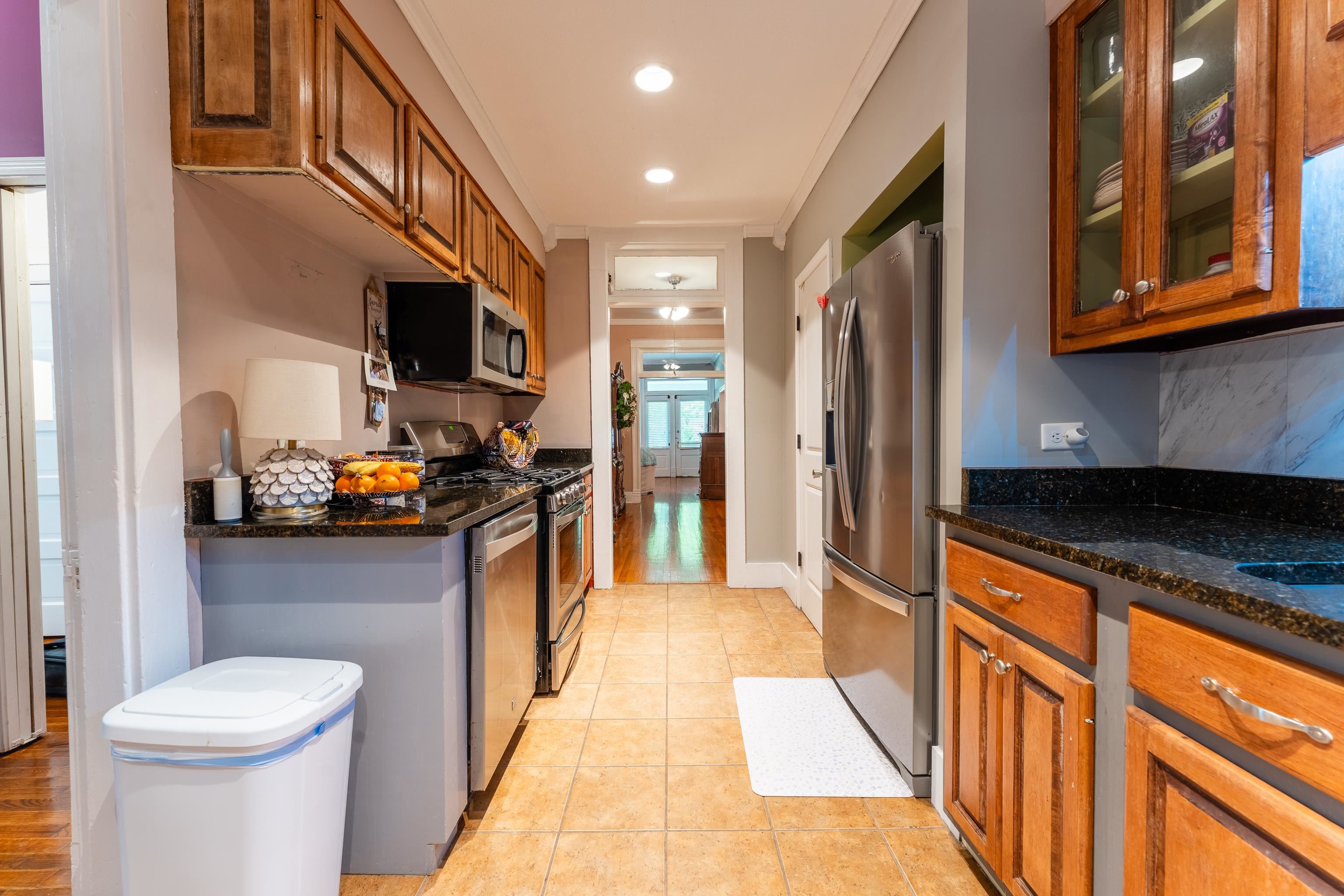 171 White Street Savannah, TN 38372 - Photo 4 of 36 a kitchen with stainless steel appliances granite countertop a refrigerator a stove and a sink