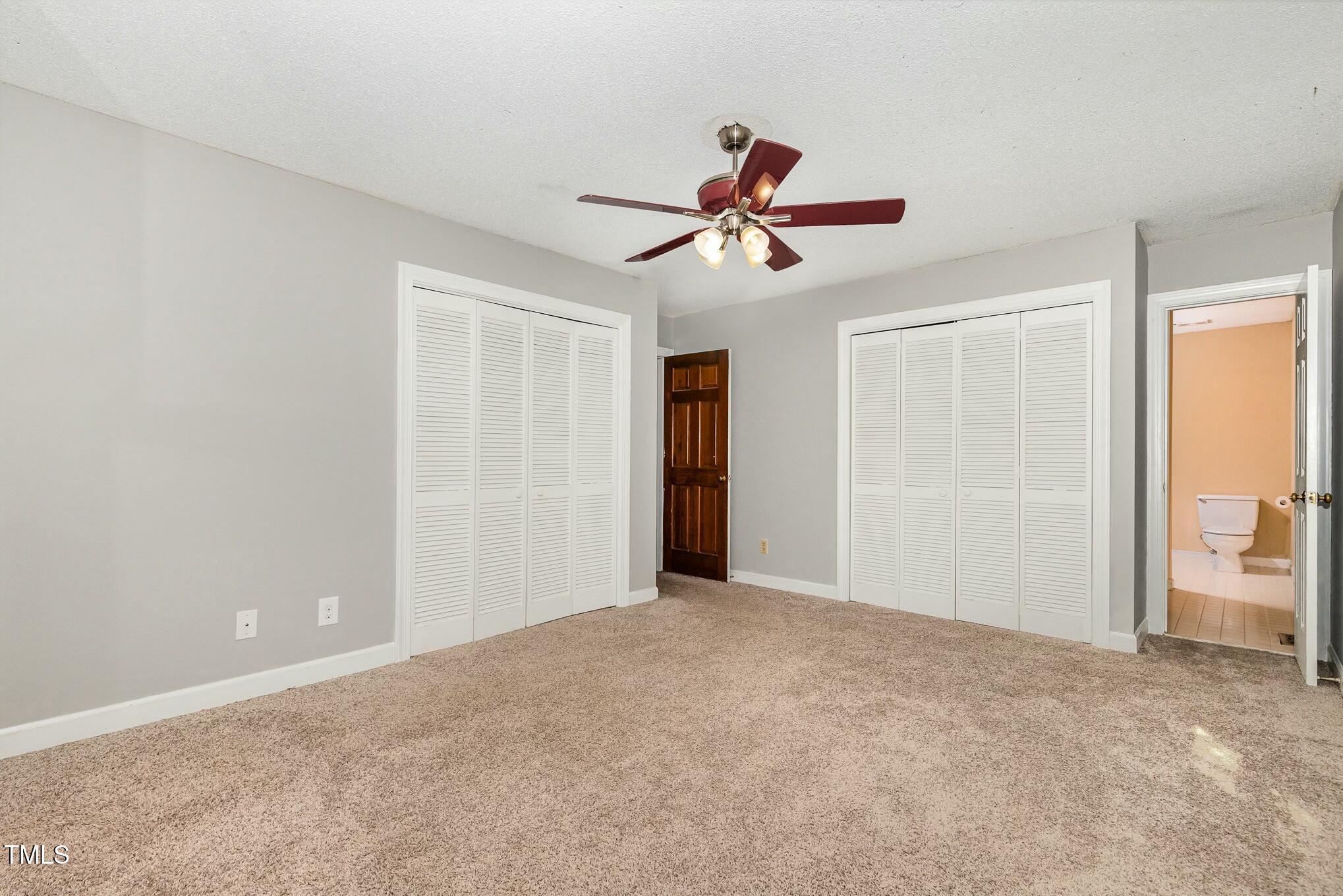 3109 East Folkestone Place Raleigh, NC 27604 - Photo 13 of 25 a view of room with a ceiling fan and entryway