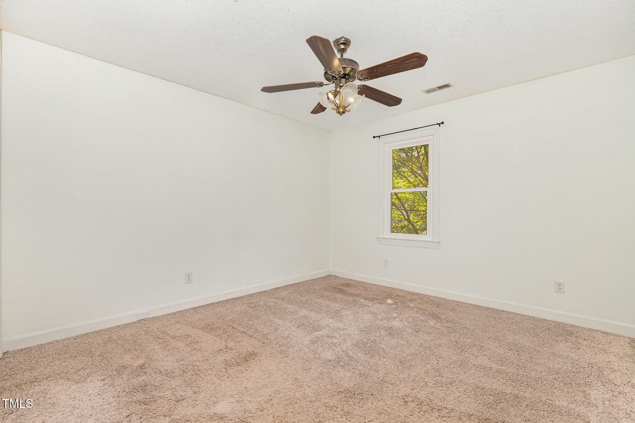3109 East Folkestone Place Raleigh, NC 27604 - Photo 15 of 25 an empty room with a window
