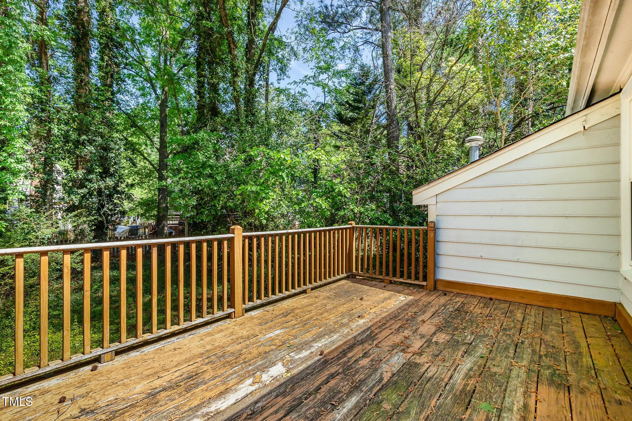 3109 East Folkestone Place Raleigh, NC 27604 - Photo 21 of 25 a view of wooden balcony and trees