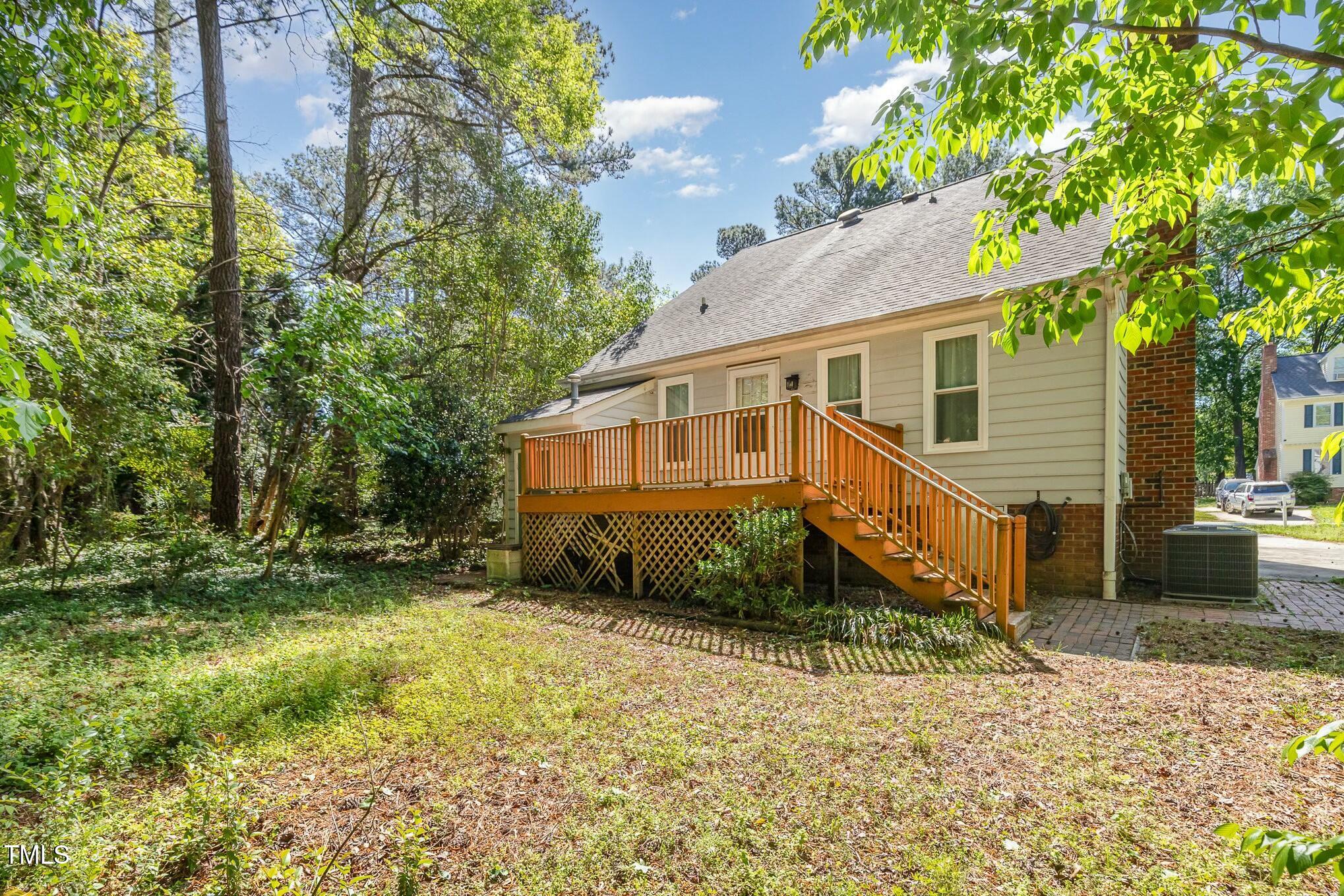 3109 East Folkestone Place Raleigh, NC 27604 - Photo 23 of 25 a view of a house with a yard