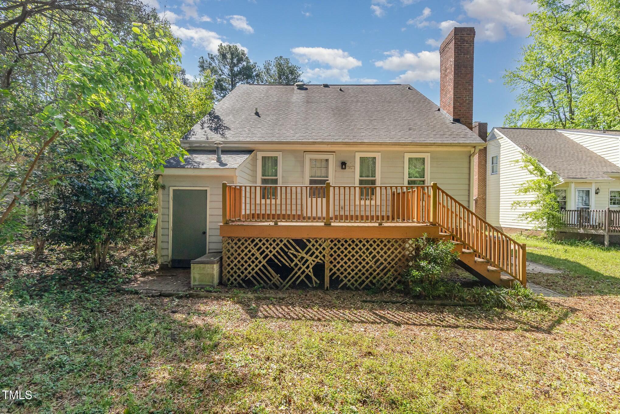 3109 East Folkestone Place Raleigh, NC 27604 - Photo 24 of 25 a front view of a house with a yard