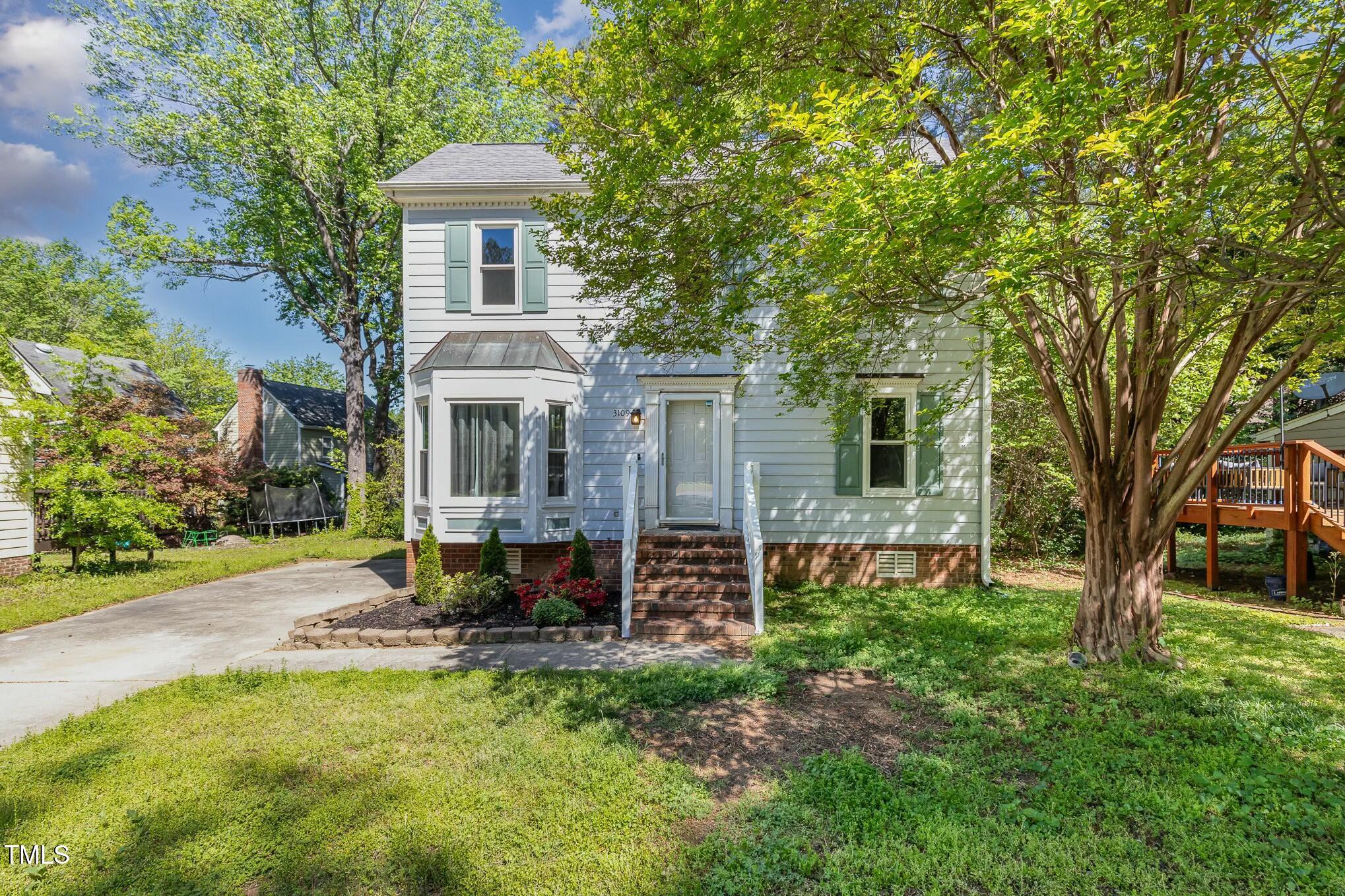3109 East Folkestone Place Raleigh, NC 27604 - Photo 3 of 25 a view of a house with a yard