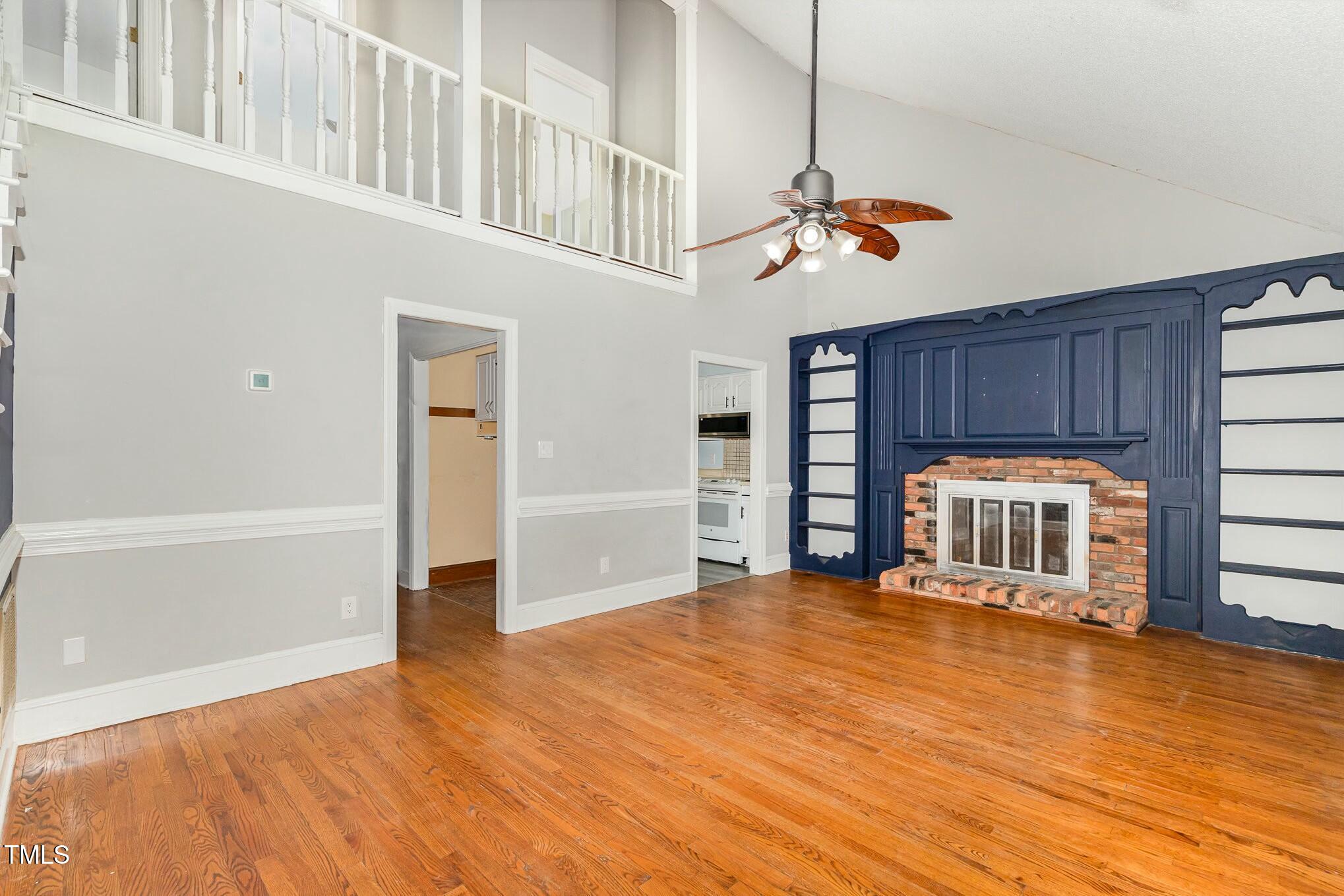 3109 East Folkestone Place Raleigh, NC 27604 - Photo 7 of 25 a view of a livingroom with a staircase