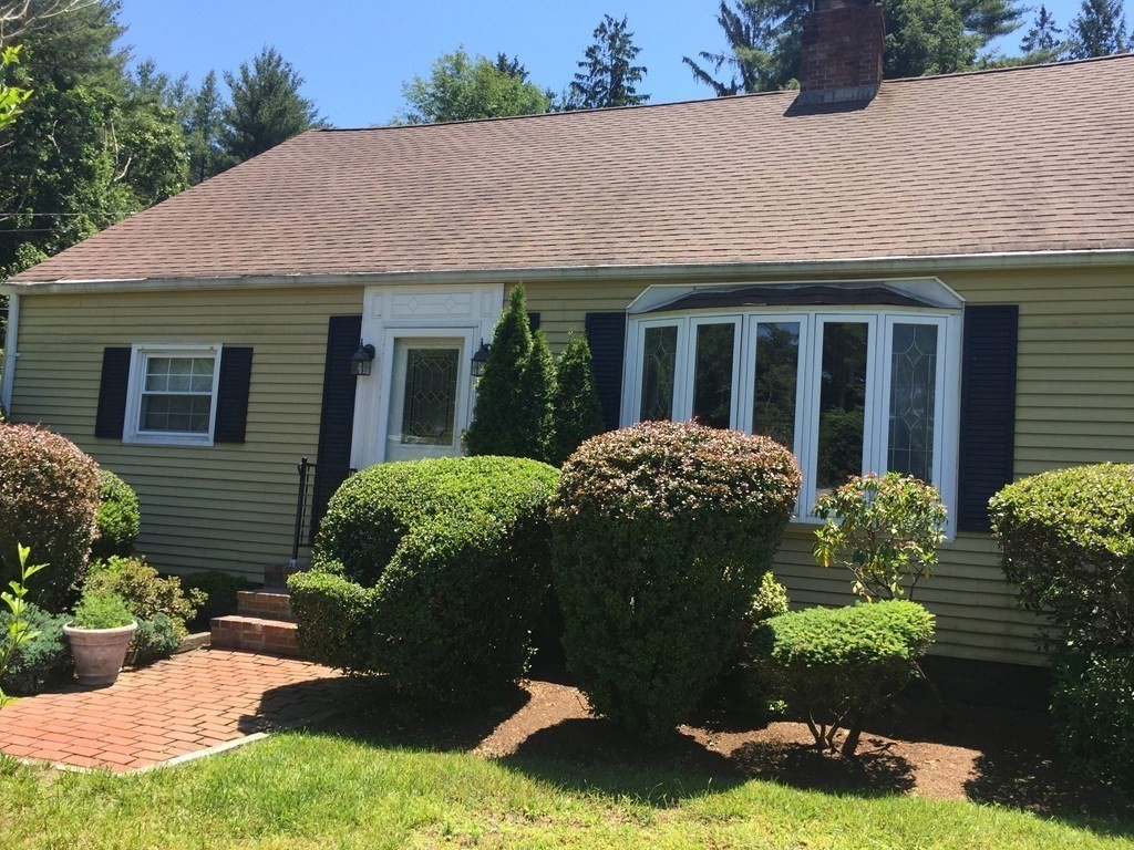 9 Brimfield Road Monson, MA 01057 - Photo 1 of 27 a view of a house with a garden and plants
