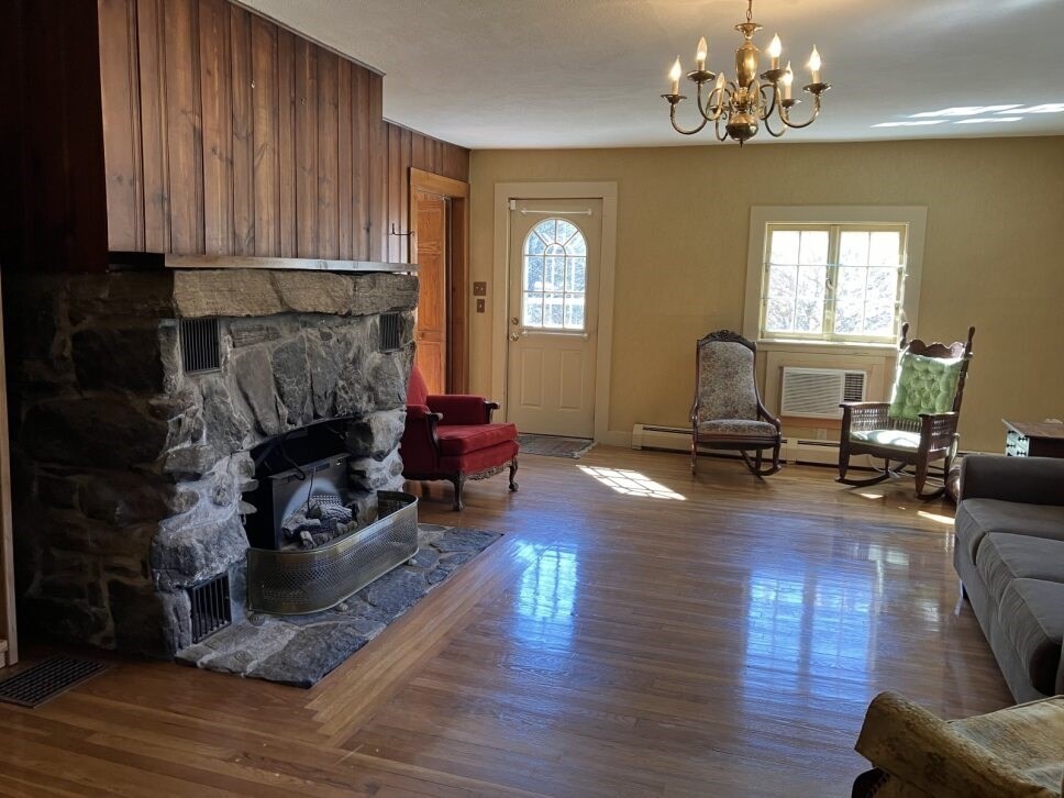 9 Brimfield Road Monson, MA 01057 - Photo 11 of 27 a living room with furniture or couch and a chandelier