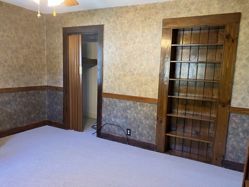 9 Brimfield Road Monson, MA 01057 - Photo 15 of 27 an empty room with a fireplace