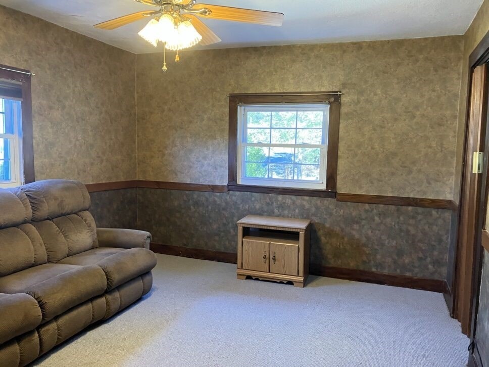 9 Brimfield Road Monson, MA 01057 - Photo 16 of 27 a living room with furniture and a fireplace
