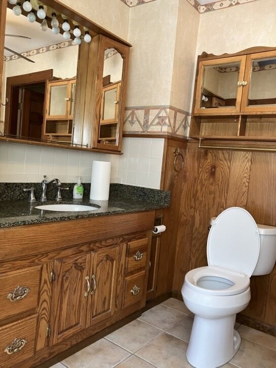 9 Brimfield Road Monson, MA 01057 - Photo 18 of 27 a bathroom with a toilet a sink and a mirror