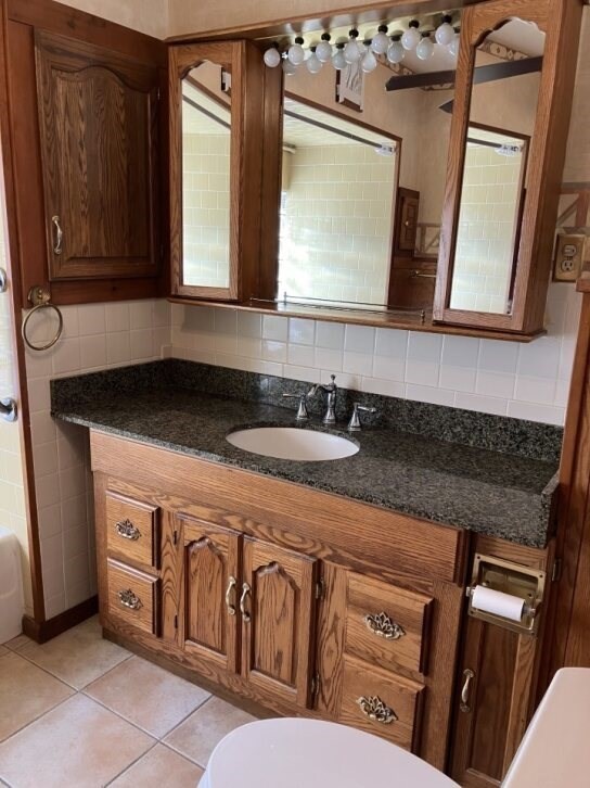 9 Brimfield Road Monson, MA 01057 - Photo 19 of 27 a bathroom with a granite countertop double vanity sink and mirror