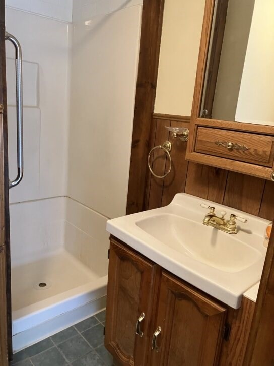9 Brimfield Road Monson, MA 01057 - Photo 23 of 27 a bathroom with a sink a vanity and shower