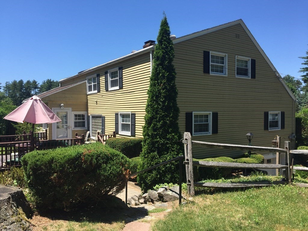 9 Brimfield Road Monson, MA 01057 - Photo 3 of 27 a front view of a house with a yard
