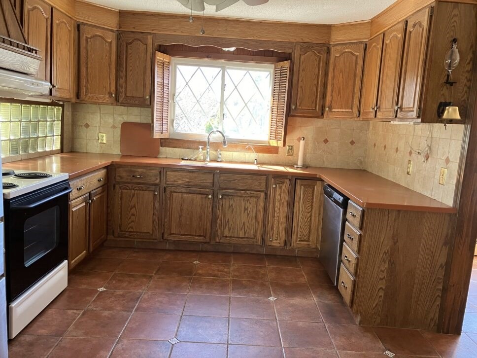 9 Brimfield Road Monson, MA 01057 - Photo 8 of 27 a kitchen with a sink window and cabinets