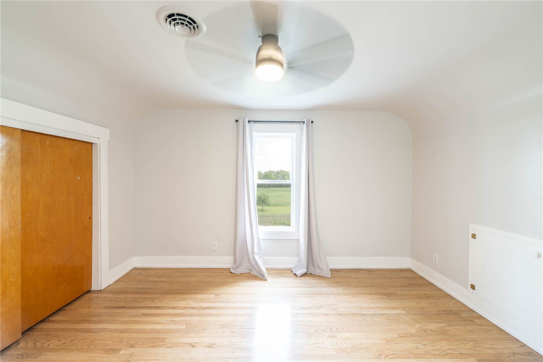 190 Swailes Road Troy, OH 45373 - Photo 19 of 82 This airy bedroom features gleaming hardwood floors and ample natural light through its window.