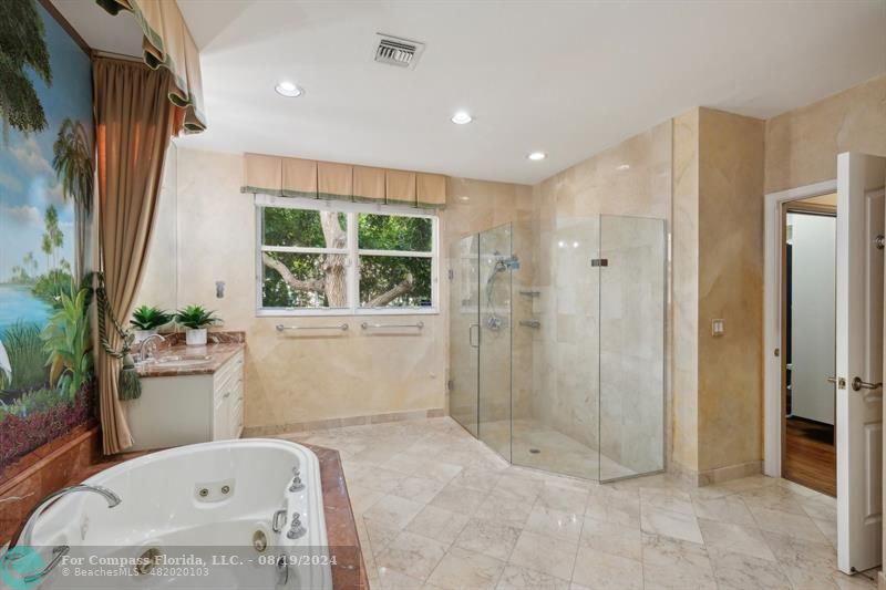 2515 Montclaire Circle Weston, FL 33327 - Photo 18 of 51 a bathroom with a tub shower and sink