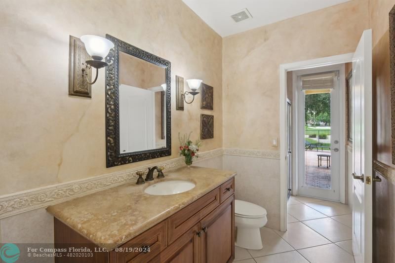2515 Montclaire Circle Weston, FL 33327 - Photo 21 of 51 a bathroom with a granite countertop sink and a mirror