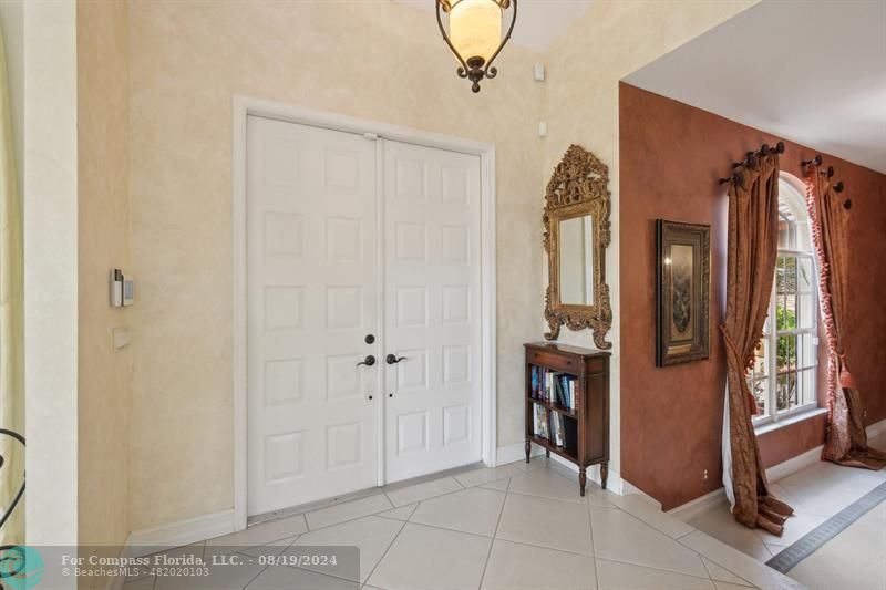 2515 Montclaire Circle Weston, FL 33327 - Photo 22 of 51 a view of a hallway with wooden shelves