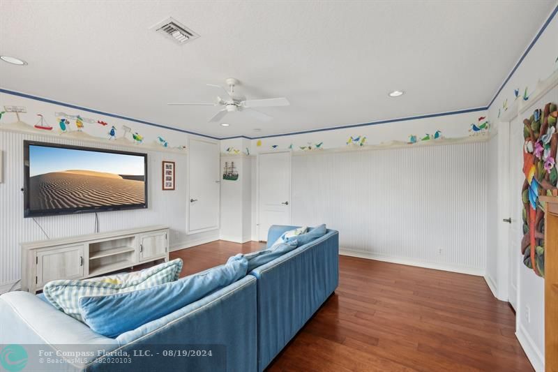 2515 Montclaire Circle Weston, FL 33327 - Photo 25 of 51 a living room with furniture and a flat screen tv