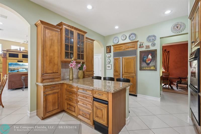 2515 Montclaire Circle Weston, FL 33327 - Photo 4 of 51 a kitchen with stainless steel appliances granite countertop a refrigerator and a sink