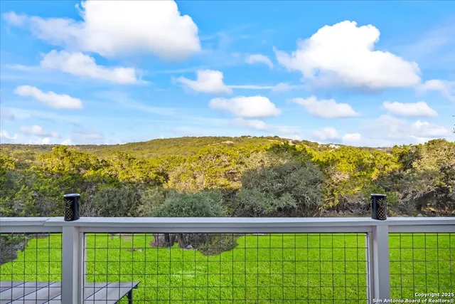 a bedroom with a bed and potted plant