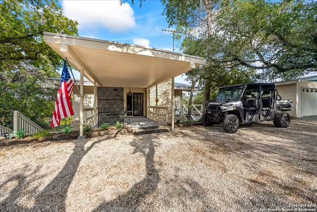 a kitchen with stainless steel appliances granite countertop a sink and a stove