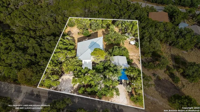 a spacious bedroom with a bed and couch