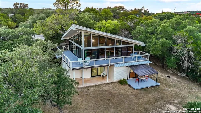 an aerial view of a house with mountain view