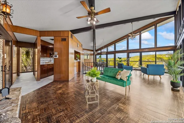 a living room with furniture and a fireplace