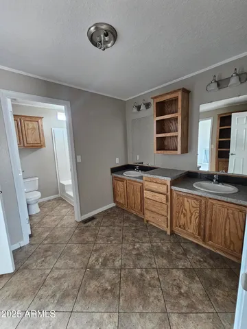 a kitchen with stainless steel appliances a sink and cabinets