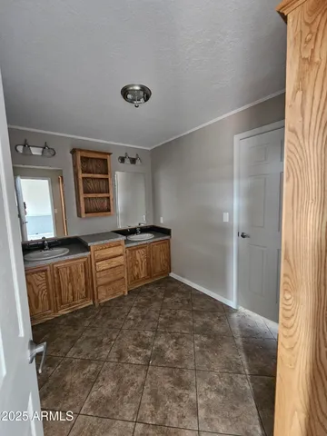 a bathroom with a tub a mirror and a shower