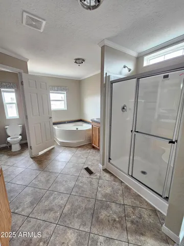 a spacious bathroom with a sink and a mirror