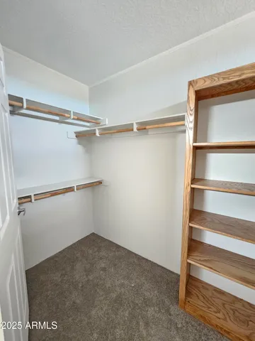 a view of an empty walk in closet