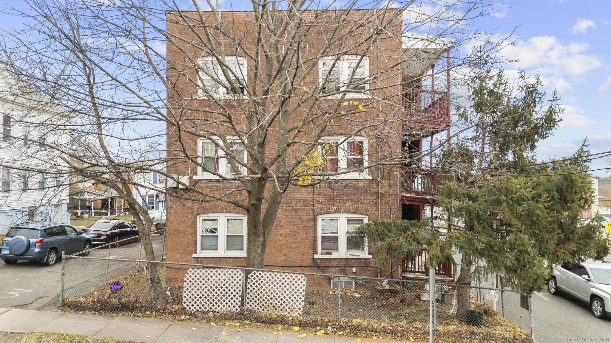 75 Clark Street New Britain, CT 06051 - Photo 11 of 14 a view of a car parked in front of a building