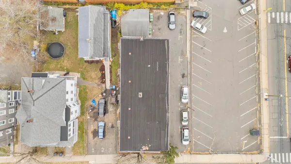 an aerial view of residential building and parking space