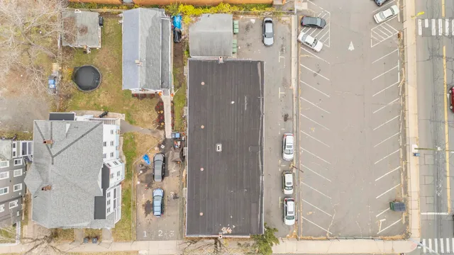 an aerial view of residential building and parking space