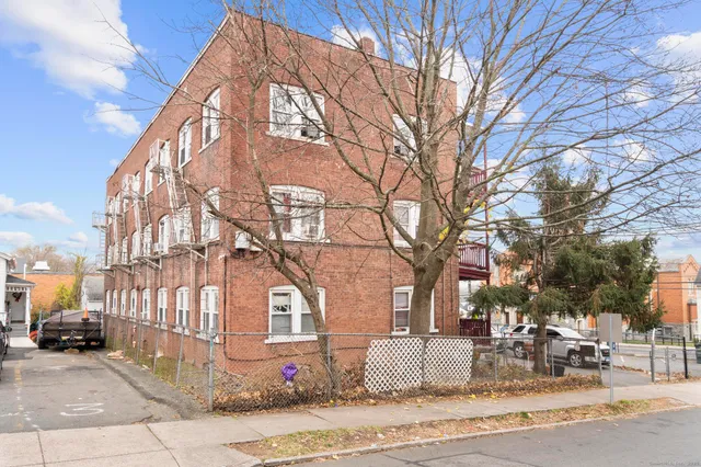 a view of a building with a yard