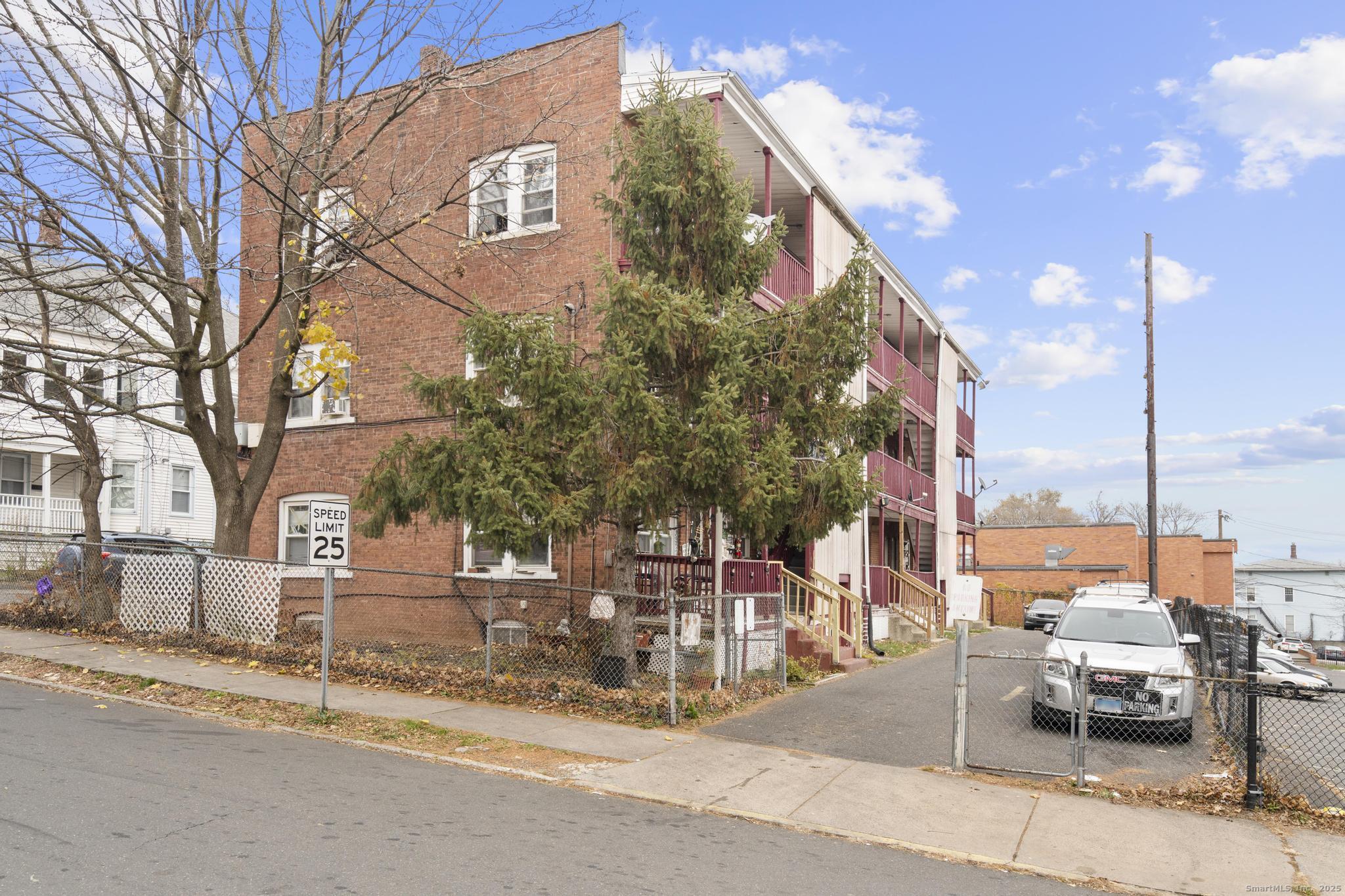 75 Clark Street New Britain, CT 06051 - Photo 8 of 14 a view of a building with a bench and trees