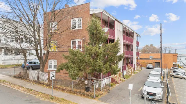 a view of a car parked in front of a building