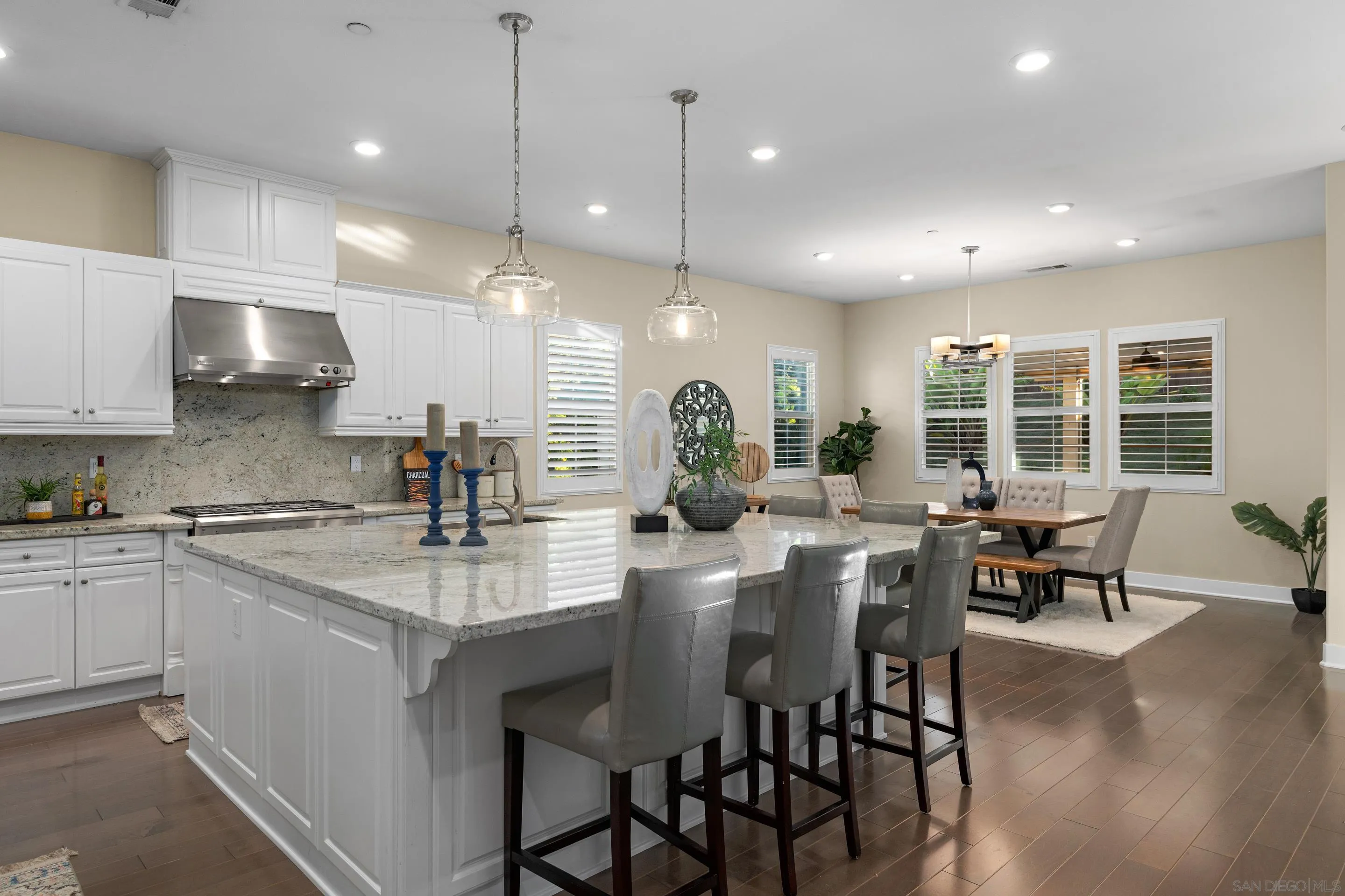 5401 Reef Circle Carlsbad, CA 92008 - Photo 11 of 45 a kitchen with counter space appliances and a dining table