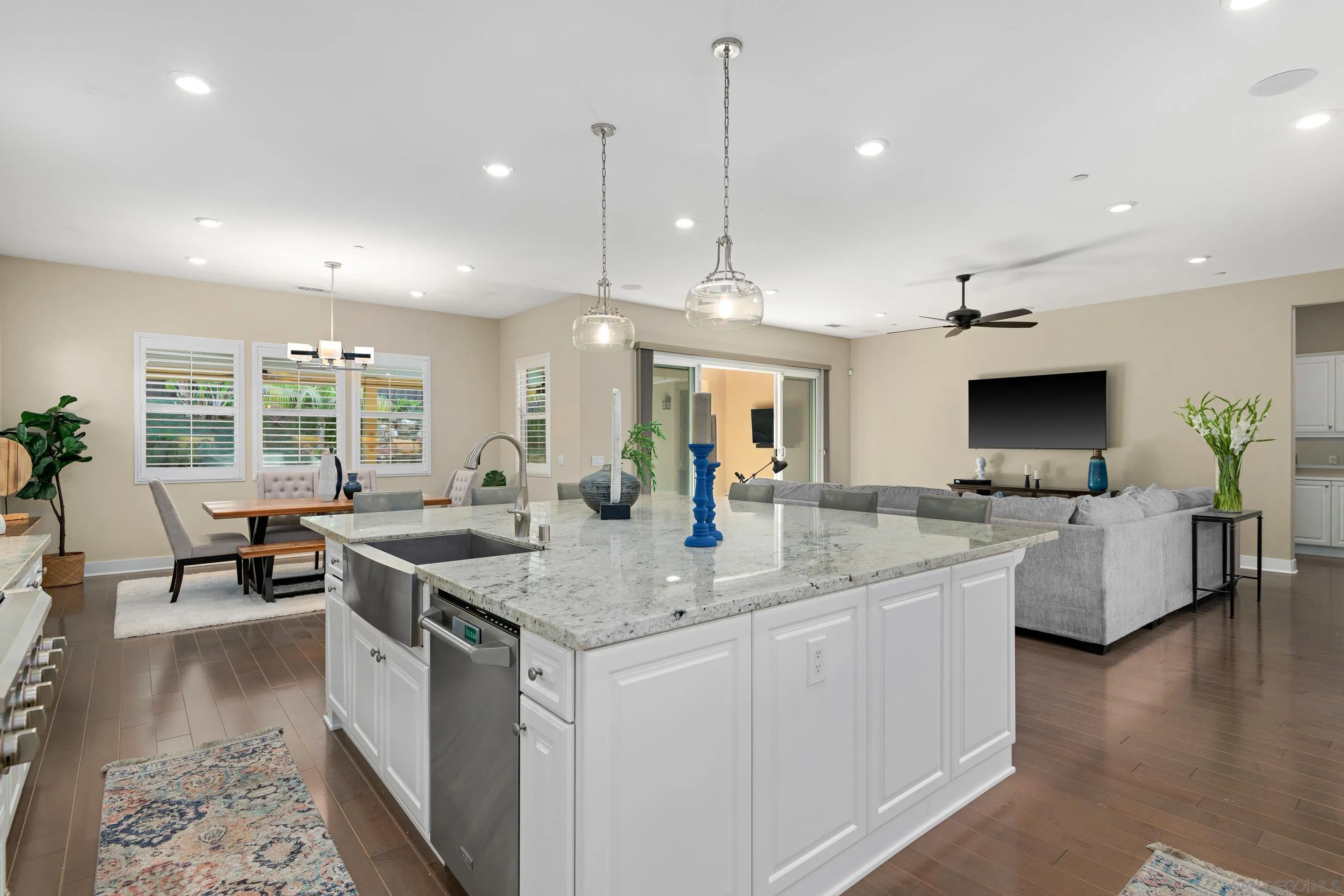 5401 Reef Circle Carlsbad, CA 92008 - Photo 18 of 45 a kitchen with center island table and chairs in it
