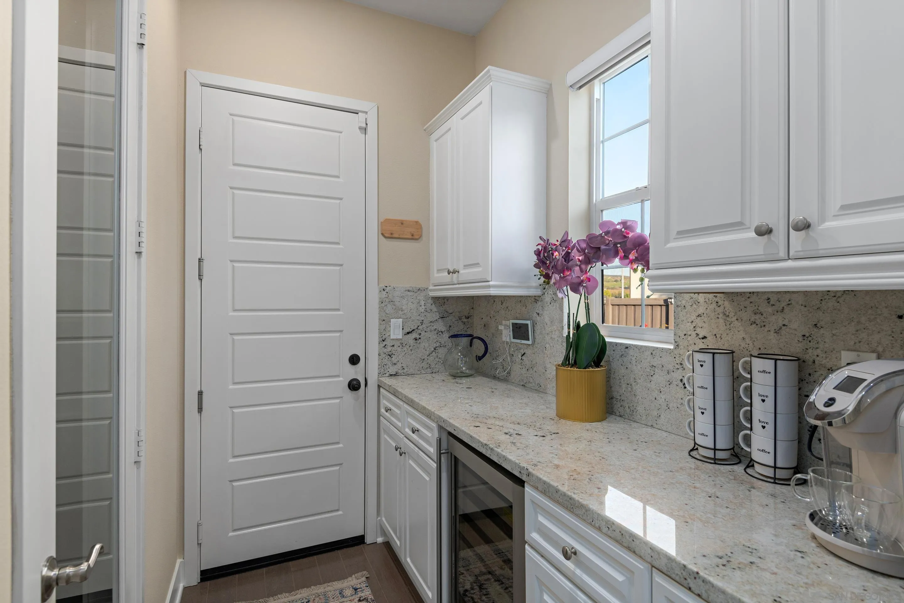 5401 Reef Circle Carlsbad, CA 92008 - Photo 19 of 45 a kitchen with a sink and cabinets