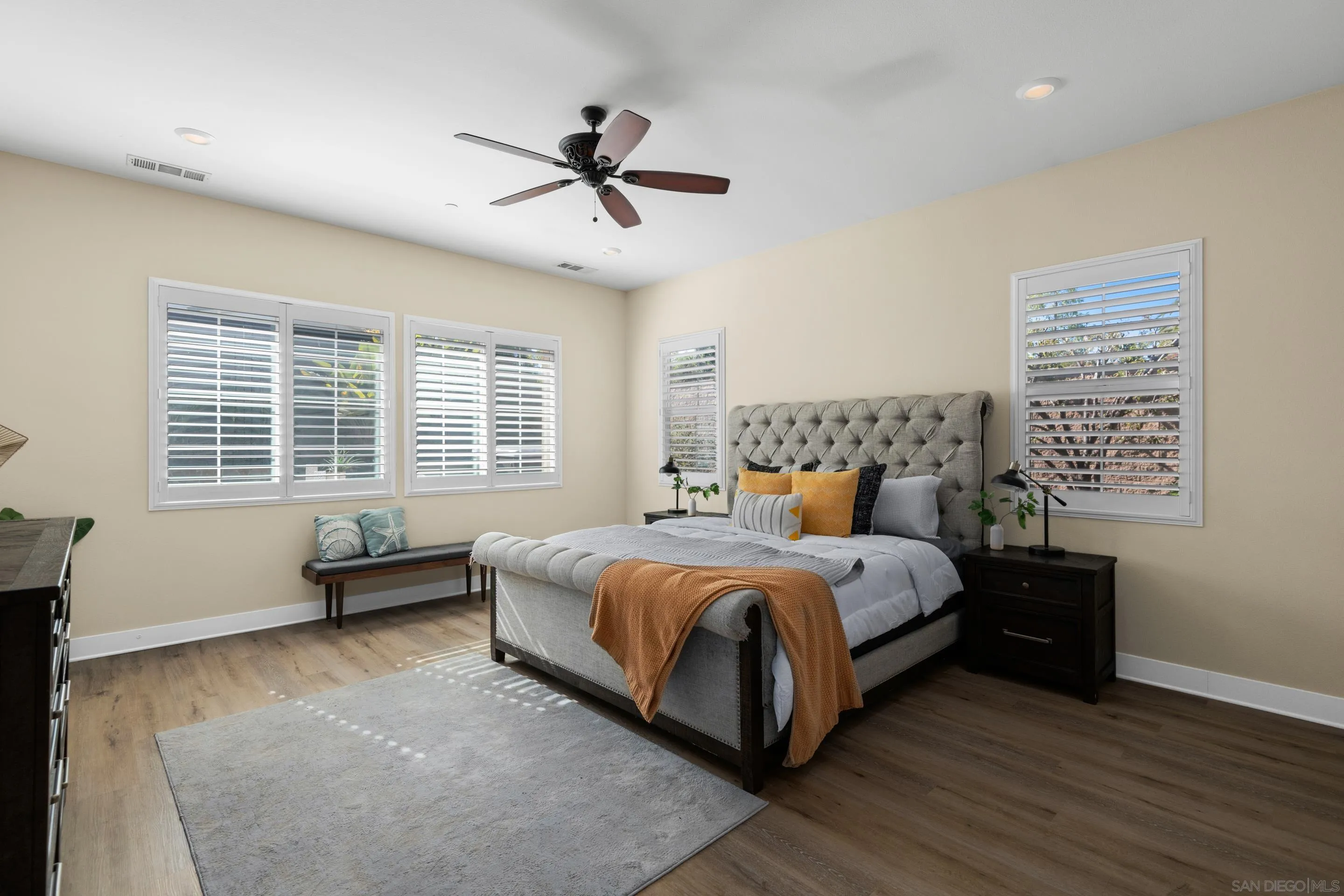 5401 Reef Circle Carlsbad, CA 92008 - Photo 20 of 45 a bedroom with a bed a couch and a window