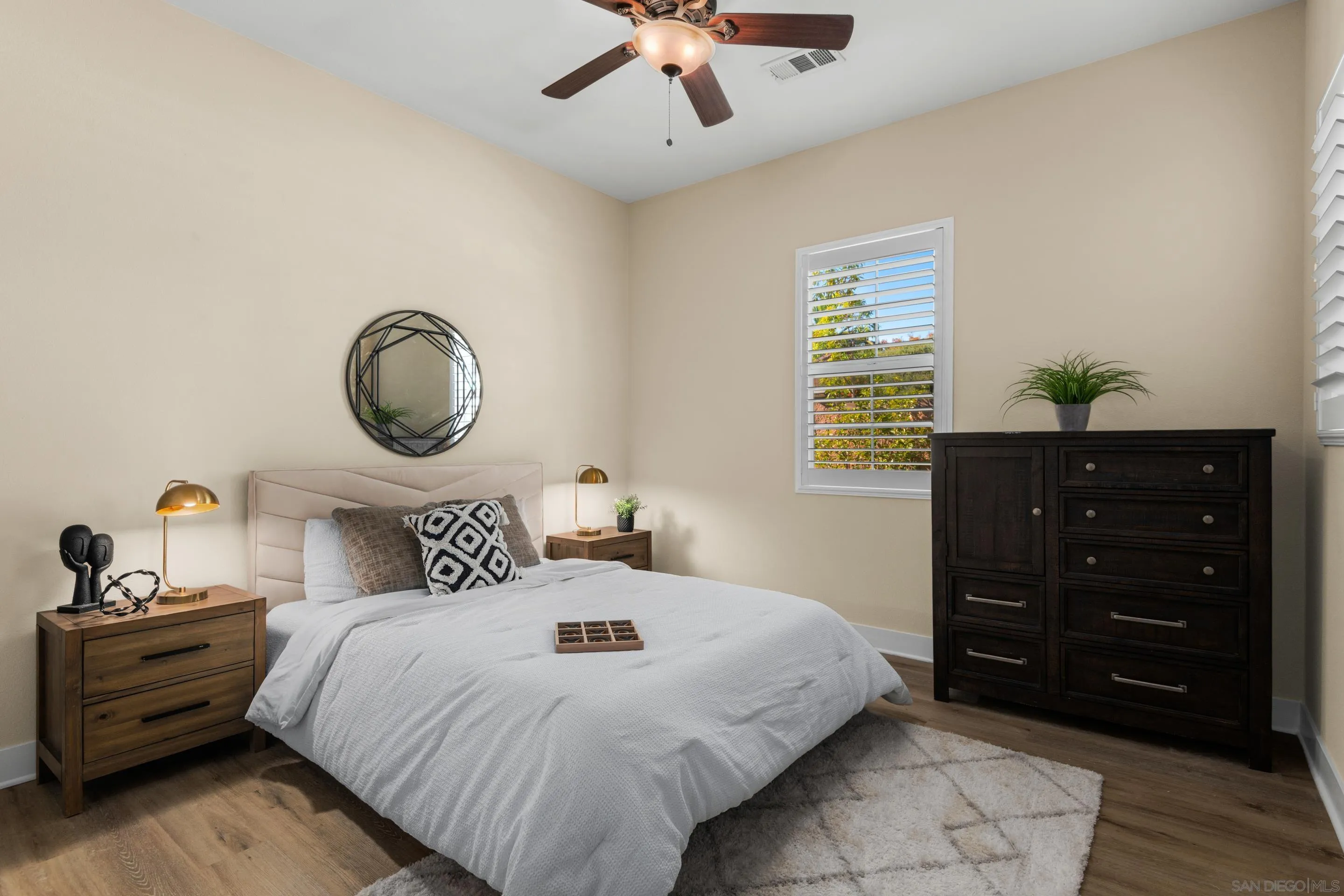5401 Reef Circle Carlsbad, CA 92008 - Photo 30 of 45 a bedroom with a bed and cabinet