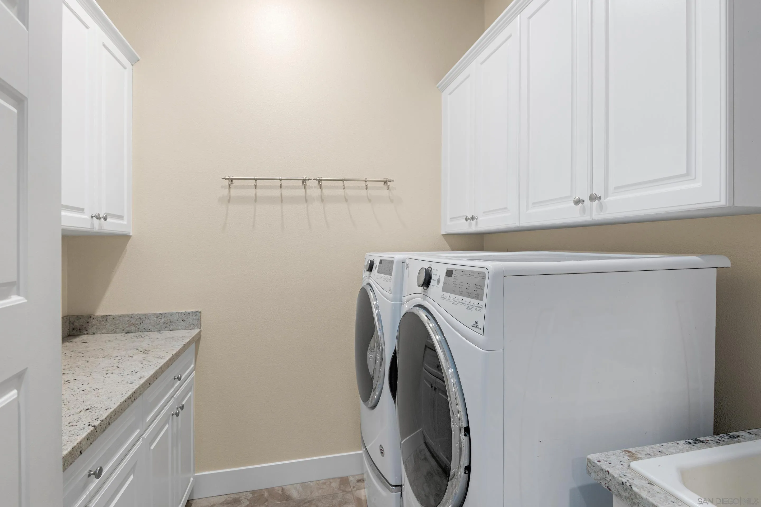 5401 Reef Circle Carlsbad, CA 92008 - Photo 33 of 45 a utility room with dryer and washer