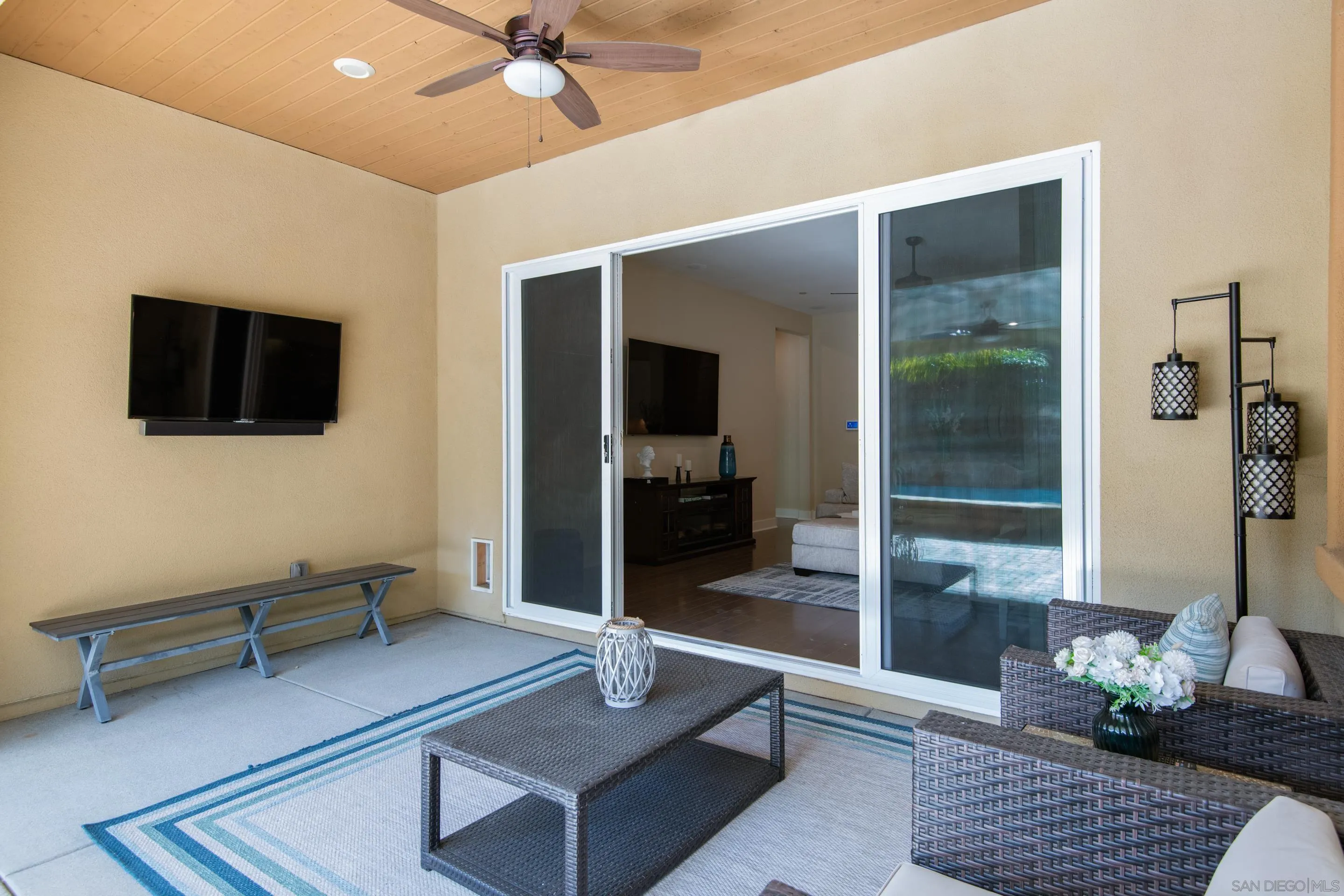 5401 Reef Circle Carlsbad, CA 92008 - Photo 35 of 45 a living room with furniture and a flat screen tv