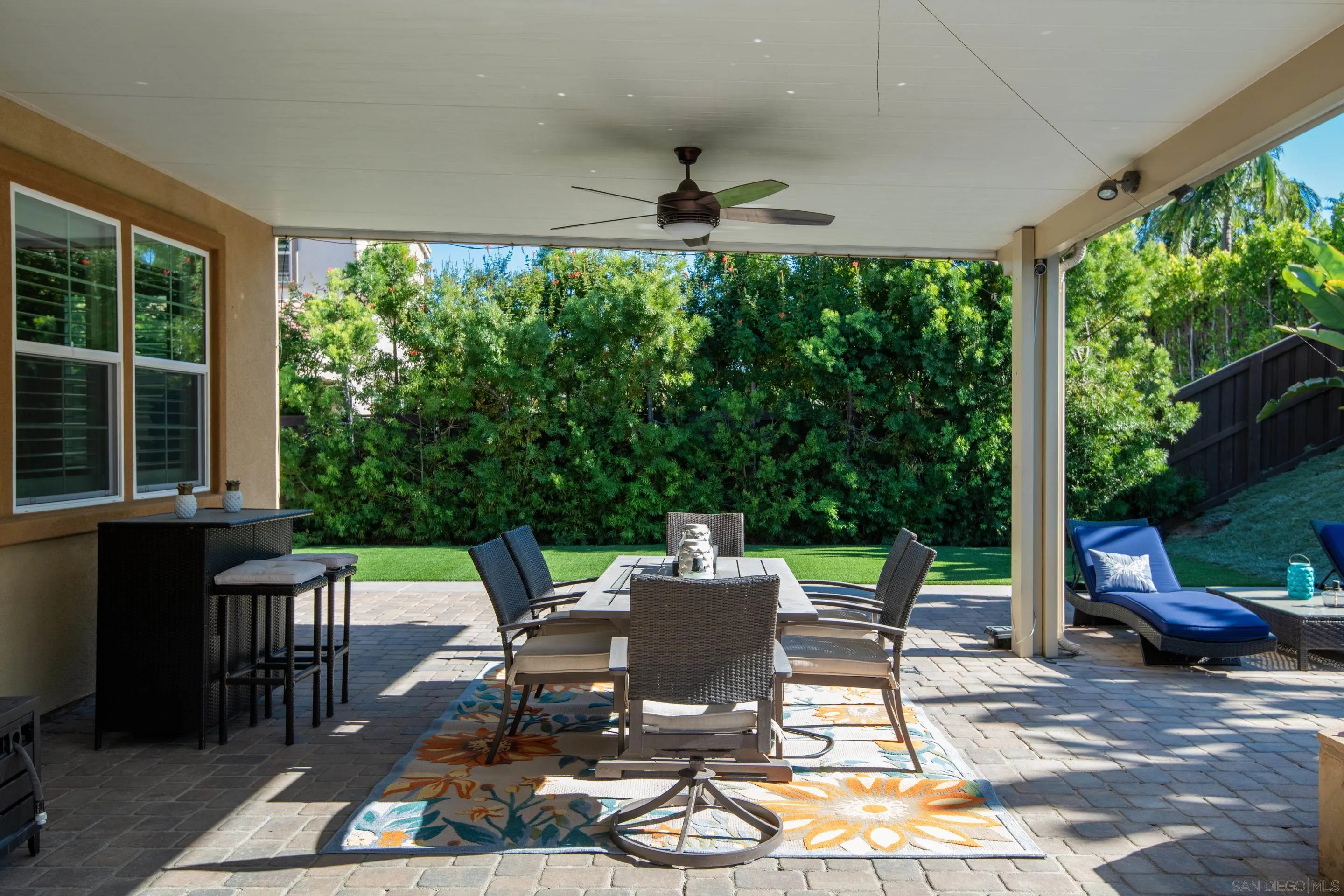 5401 Reef Circle Carlsbad, CA 92008 - Photo 36 of 45 a view of a patio with a dining table and chairs