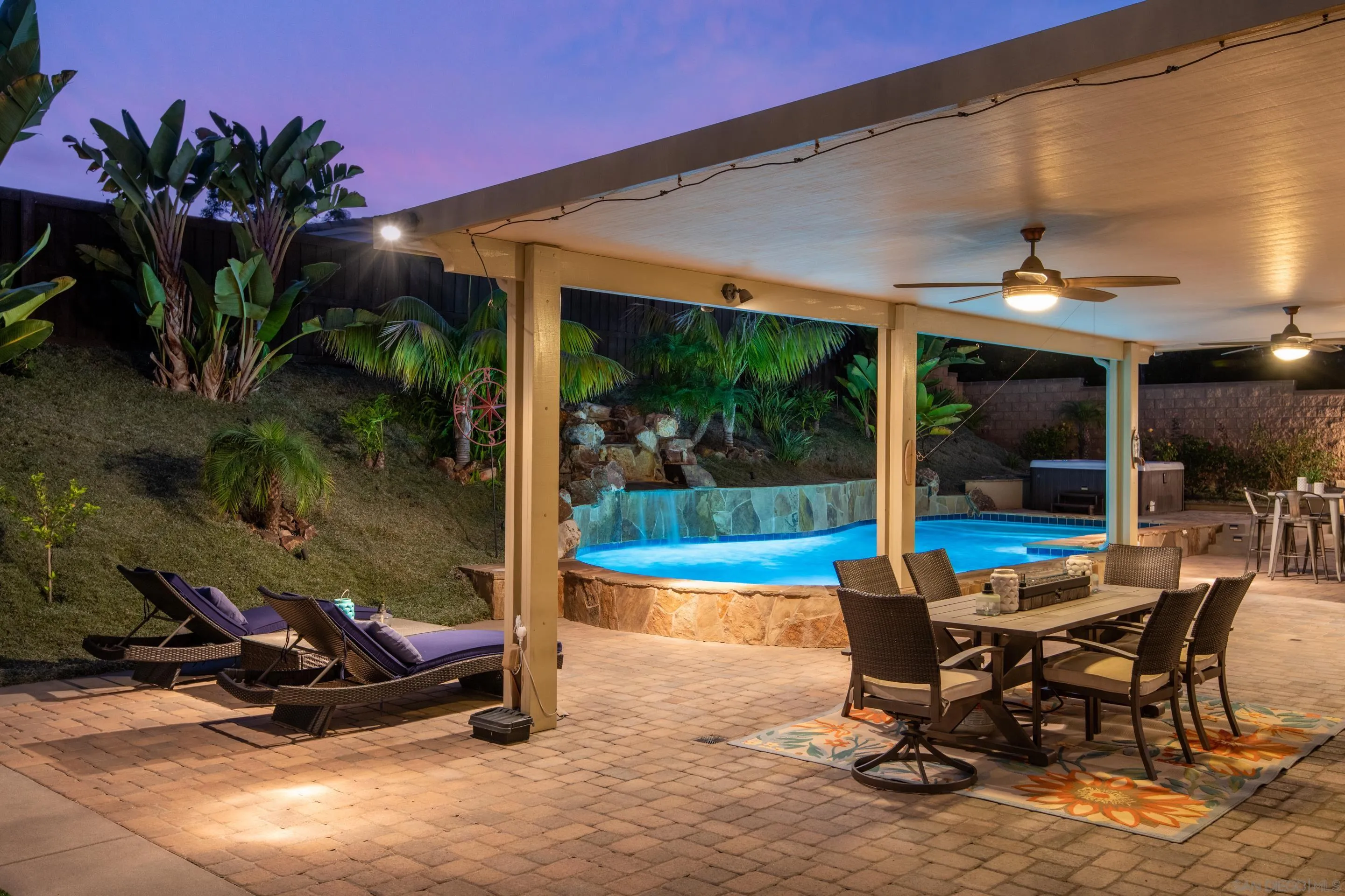 5401 Reef Circle Carlsbad, CA 92008 - Photo 45 of 45 a view of a patio with a table and chairs under an umbrella